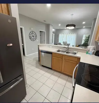 a kitchen with a sink and a dishwasher at TownHouse at Emerald Island Resort Near Disney in Kissimmee