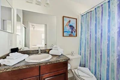 a bathroom with a sink and a toilet at Family Retreat at Lake Berkley Resort! in Kissimmee