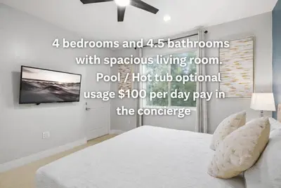 a bedroom with a bed and a flat screen tv at Villa near Orlando's Attractions in Orlando