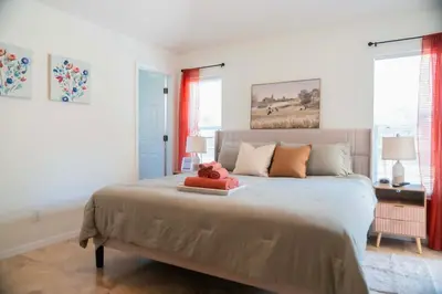 a bedroom with a bed with a teddy bear on it at Gated Pool Home 20 Min to Disney, Uni, MCO in Kissimmee