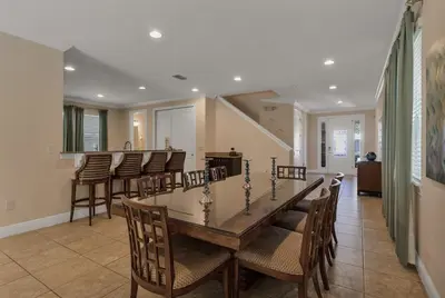 a dining room with a table and chairs at 480 Lasso Dr. · 480 Villa - Large Luxury 7BD Home - SpaPool in Orlando