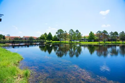 a body of water with a bridge and trees at 213 Hideaway Beach way in Kissimmee