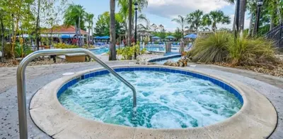 a hot tub at a resort with palm trees at 213 Hideaway Beach way in Kissimmee