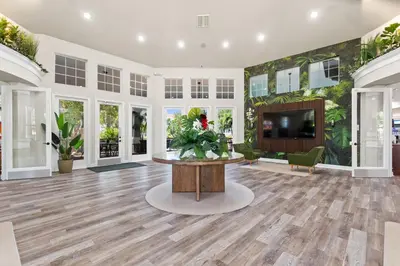 a large living room with a table and a tv at 2232 Wyndham Palms Way in Kissimmee