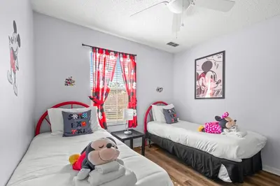 a bedroom with two beds with stuffed animals on them at Family Escape! HotTub+Grill+Disney! in Kissimmee