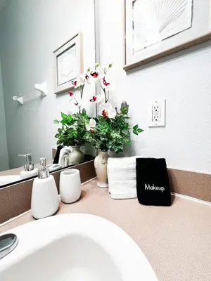 a bathroom counter with a sink and a mirror at Hot Tub, BBQ - Near Disney Fun! in Kissimmee