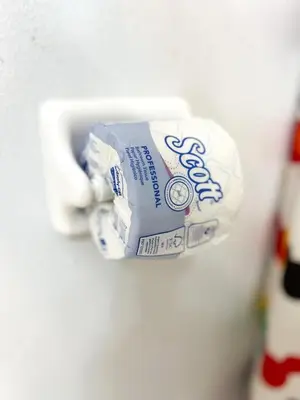 a tube of toothpaste is hanging from a sink at Hot Tub, BBQ - Near Disney Fun! in Kissimmee