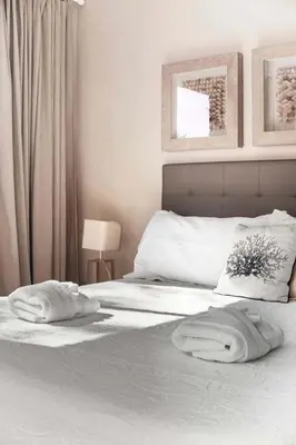 a bedroom with a bed with two towels on it at Two Story Resort Retreat Near Theme Parks in Orlando