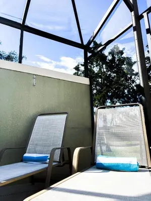 two tables and chairs on a boat with windows at Paradise Found: Private 5-Bed Townhouse Oasis in Kissimmee