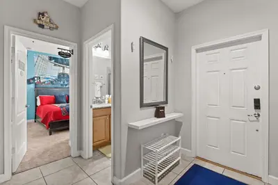a bathroom with a sink and a mirror at Themed Villa with Private Pool Games Massage Chair in Kissimmee