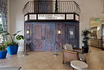 a lobby with a large wooden door in a building at Themed Villa with Private Pool Games Massage Chair in Kissimmee