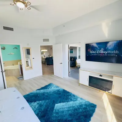 a living room with a large blue rug at Your Epic Disney Getaway Spacious Home 3BD 3BA in Orlando