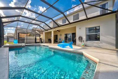 a large swimming pool with a glass ceiling at Water View Pool Home Near Disney in Kissimmee