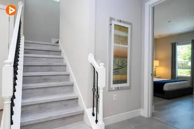 a staircase in a home with a stair case at Perfect Home 5 Minutes from Disney 5BD 15P in Orlando