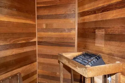 a bathroom with a wooden wall with a trough in it at The Beauty at Emerald Island in Kissimmee