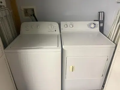two white refrigerators in a kitchen next to each other at La Isla at Paradise by PropertyChekker! in Kissimmee