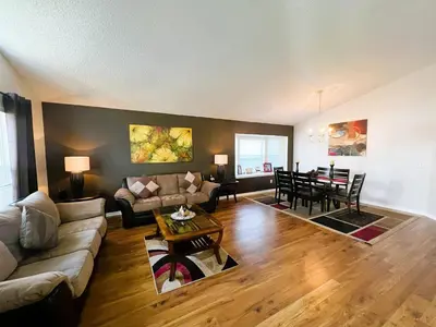 a living room with a couch and a table at The Haven in Kissimmee