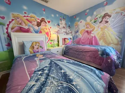 a bedroom with a disney princess wall mural at Mickey's Castle by PropertyChekker! in Orlando