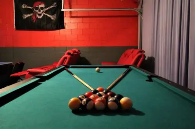 a pool table with billiard balls on top of it at Mickey's Castle by PropertyChekker! in Orlando