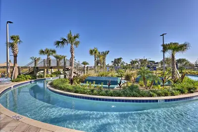 a pool at a resort with palm trees at Lanai and Private Pool, 8 Mi to WDW Family Getaway! in Kissimmee