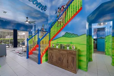 a childrens room with a staircase with a slide at Free Arcade! All Themed! South Facing Pool & Spa! in Orlando