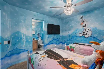 a bedroom with a mickey mouse mural on the wall at Free Arcade! All Themed! South Facing Pool & Spa! in Orlando