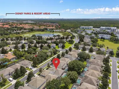 an aerial view of a residential neighborhood with a red marker at Free Arcade! All Themed! South Facing Pool & Spa! in Orlando