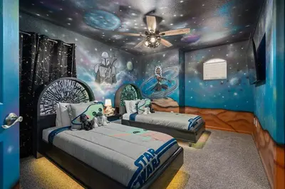 a bedroom with two beds in a room with planets at Free Arcade! All Themed! South Facing Pool & Spa! in Orlando