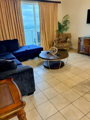 a living room with a couch and a table at Blue Heron Beach Resort 1-809 in Orlando