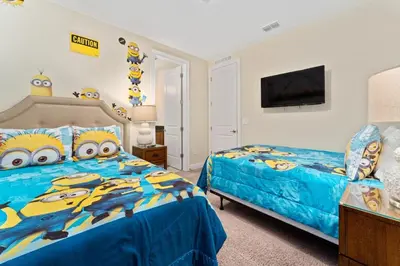 a bedroom with two beds with hello kitty pillows at Amazing Stay 10 min from Disney in Orlando