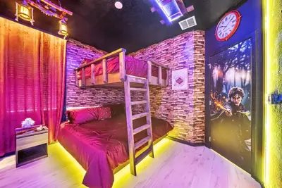 a room with a bunk bed and a brick wall at Dream 8-Bedroom Home with Pool in Kissimmee