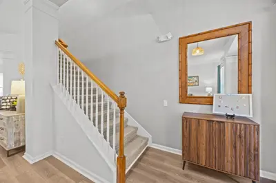 a staircase in a home with a mirror at 6 BR Home, Themed Rooms, Private Pool, Windsor Hills by Blue Sky Villas in Orlando