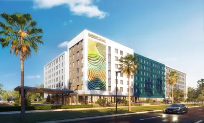 a building with a painting on the side of it at Staybridge Suites Orlando Universal Blvd by IHG in Orlando