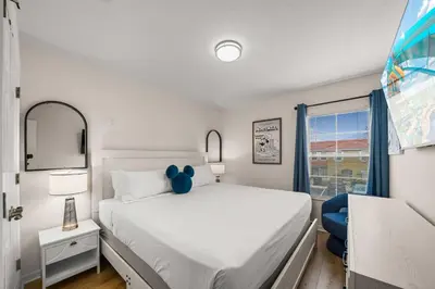 a bedroom with a bed with a teddy bear on it at 8564 Bay Lilly Loop in Kissimmee