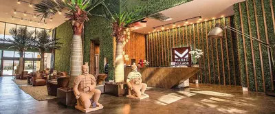 a lobby with statues of men in a hotel at 4BR Disney Area Townhome - Pool, Grill & Clubhouse in Orlando