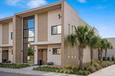 a rendering of a house with a palm tree at 4BR Disney Area Townhome - Pool, Grill & Clubhouse in Orlando