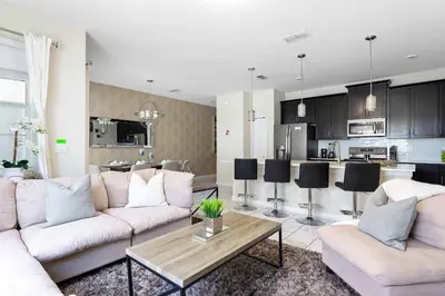 a living room with a couch and a table at Casa 4Q Storey Lake - Piscina Privativa in Kissimmee