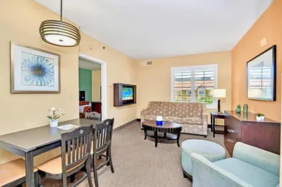 a living room with a couch and a table at Condo w Hot Tub & Pool - Steps to Universal Studio in Orlando