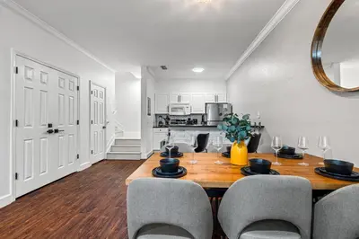 a dining room with a wooden table and chairs at Near Disney! Kissimmee Home for 12 w/ Pool Access! in Kissimmee