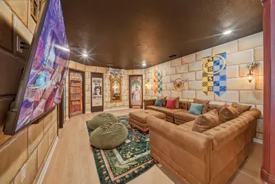 a living room with a couch and a tv at Brand NEW 10Bdrms8Bath Luxury in Orlando