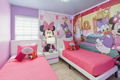 two beds in a room with a hello kitty bedroom at Disney Heated Pool & Arcade Home 15 mins to Park in Kissimmee