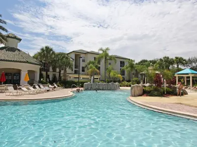 a swimming pool at a resort with people in it at Apartment Orlando Condo in der Nähe von Disney- Schläft 8 by Interhome in Kissimmee