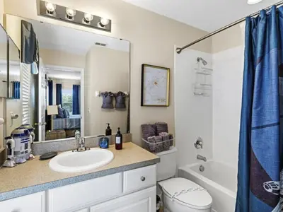 a bathroom with a sink and a toilet and a tub at Holiday Home Ferienvilla Magical Memories by Interhome in Kissimmee