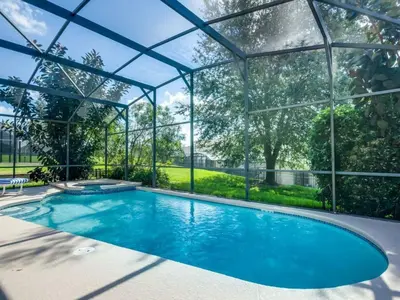 a swimming pool in a glass house with a swimming poolvisor at Holiday Home 2696LIC by Interhome in Kissimmee