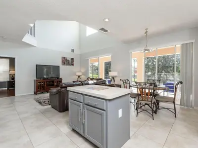 a kitchen and living room with a couch and a table at Holiday Home 2696LIC by Interhome in Kissimmee