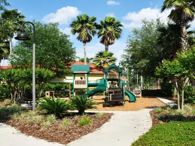 a playground at a park with palm trees at Holiday Home 2696LIC by Interhome in Kissimmee