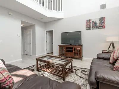 a living room with a couch and a tv at Holiday Home 2696LIC by Interhome in Kissimmee