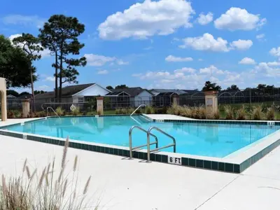 a large swimming pool with blue water at Holiday Home Ausgezeichnetes Preis-Leistungs-Verhältnis Familienvilla - Süd-West Privater Po by Interhome in Kissimmee