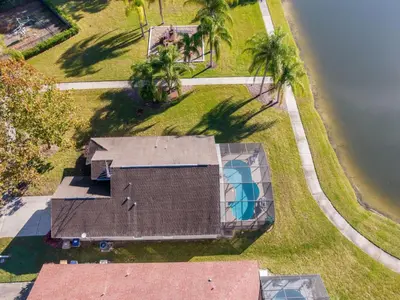 an aerial view of a house with a swimming pool at Holiday Home Moderne Villa mit Seeblick nur wenige Minuten von Disney entfernt by Interhome in Kissimmee