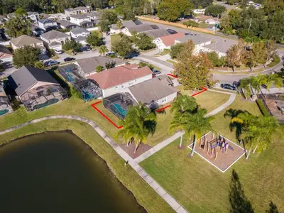 an aerial view of a neighborhood with houses and a lake at Holiday Home Moderne Villa mit Seeblick nur wenige Minuten von Disney entfernt by Interhome in Kissimmee